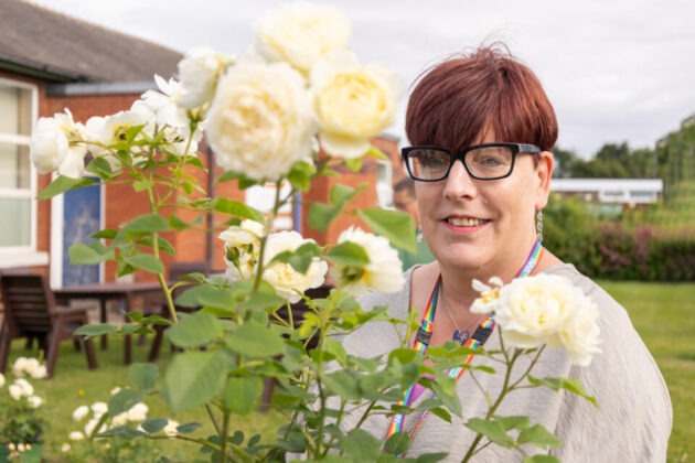 Person with glasses smiling