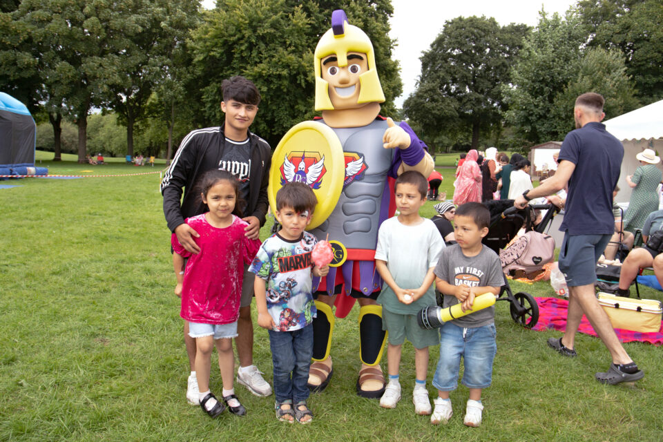 Children stood next to mascot