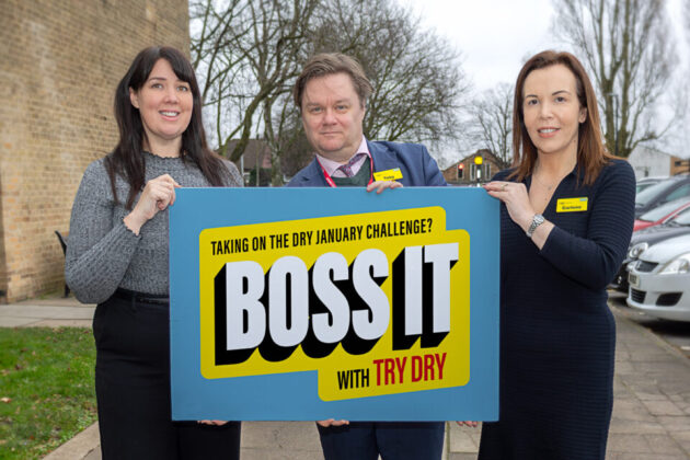 Three people holding up a sign saying taking on the dry January challenge? Boss it with try dry.